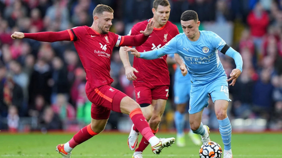 Henderson challenging  Foden in the Liverpool vs Manchester City game in the Premier League