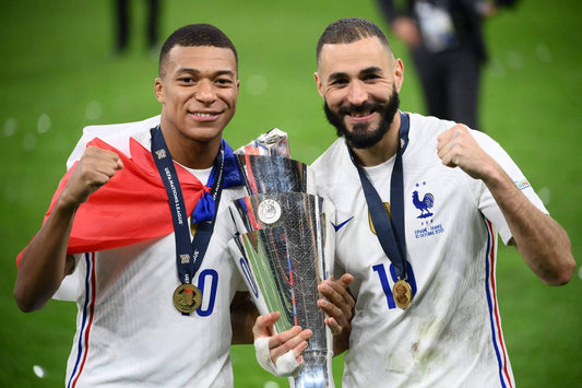 Kylian Mbappe and Karim Benzema pose with their UEFA Nations League winners medal after France beat Spain 2-1 in the final
